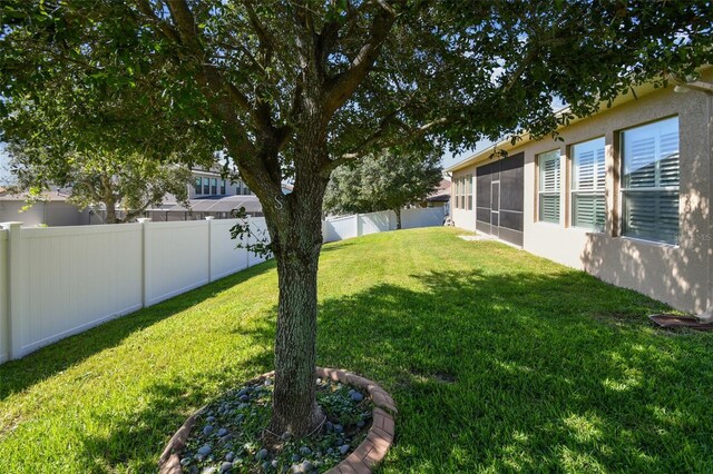 4133 Foxhound Dr, Clermont, FL 34711 - fenced backyard with a sunroom