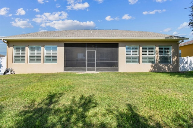4133 Foxhound Dr, Clermont, FL 34711 - rear view of house with stucco siding and a sunroom