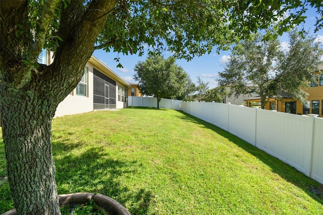 4133 Foxhound Dr, Clermont, FL 34711 - fenced backyard featuring a sunroom