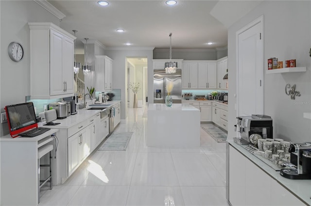 7550 John Hancock Dr, Winter Garden, FL 34787 - kitchen featuring stainless steel fridge, a sink, white cabinetry, a kitchen island, and recessed lighting