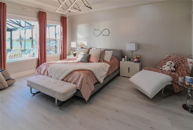 7550 John Hancock Dr, Winter Garden, FL 34787 - bedroom with light wood finished floors and baseboards