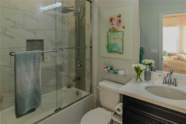 7550 John Hancock Dr, Winter Garden, FL 34787 - ensuite bathroom with bath / shower combo with glass door, vanity, and toilet