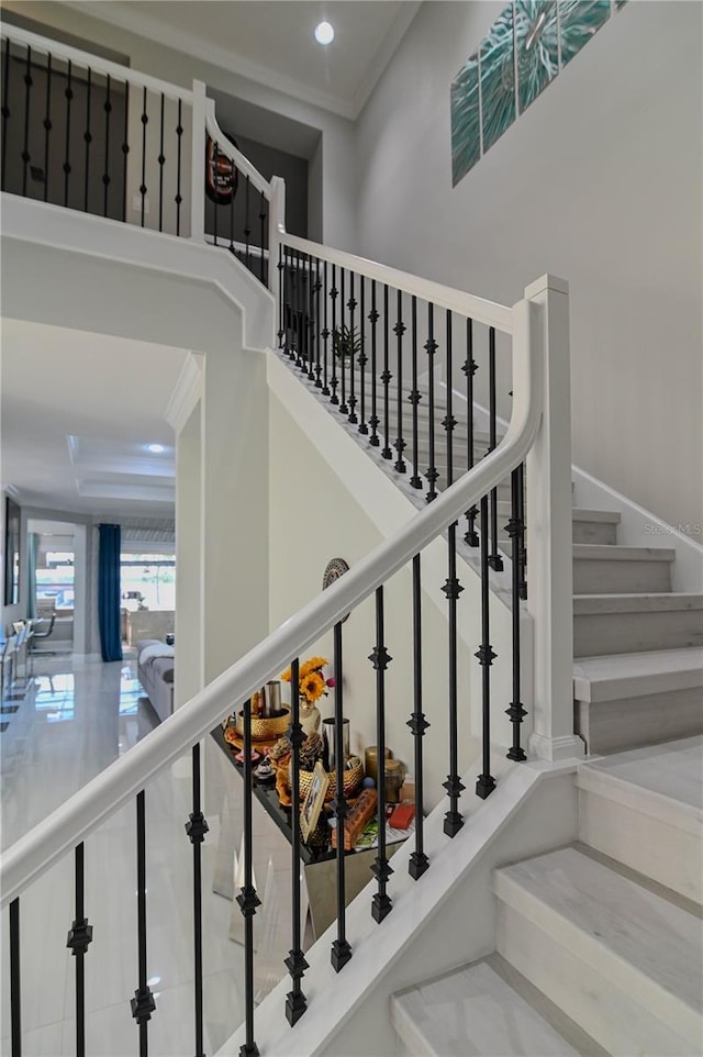 7550 John Hancock Dr, Winter Garden, FL 34787 - stairway featuring recessed lighting, ornamental molding, and a high ceiling