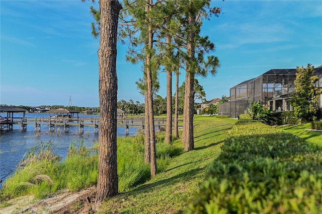 7550 John Hancock Dr, Winter Garden, FL 34787 - view of green lawn with a boat dock and a water view
