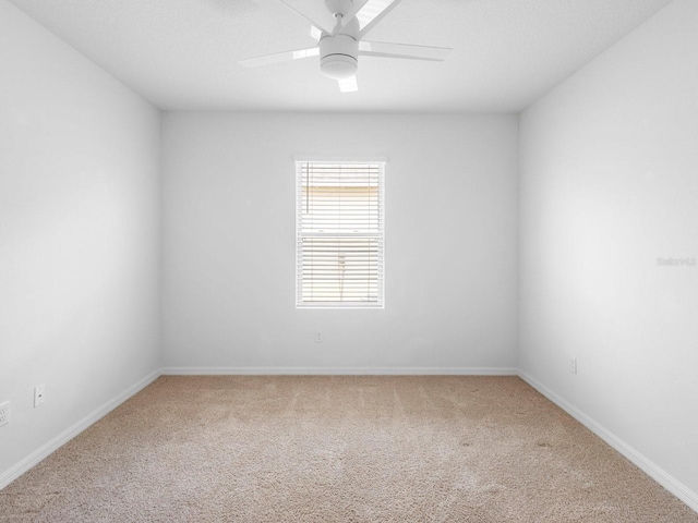 341 Alexzander Way, Winter Haven, FL 33881 - empty room featuring carpet flooring, baseboards, and ceiling fan