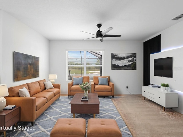 341 Alexzander Way, Winter Haven, FL 33881 - carpeted living area featuring ceiling fan and baseboards