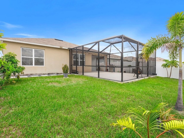341 Alexzander Way, Winter Haven, FL 33881 - rear view of property with a patio area, stucco siding, and glass enclosure