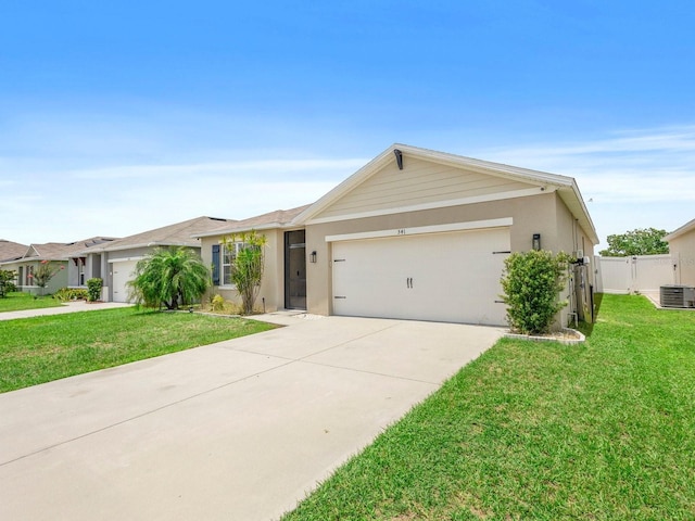 341 Alexzander Way, Winter Haven, FL 33881 - ranch-style home featuring central AC, an attached garage, concrete driveway, stucco siding, and a gate