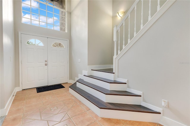 4993 Hook Hollow Cir, Orlando, FL 32837 - foyer with a high ceiling, stairs, and baseboards