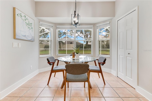 4993 Hook Hollow Cir, Orlando, FL 32837 - dining area with light tile patterned floors, baseboards, and a chandelier