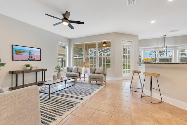 4993 Hook Hollow Cir, Orlando, FL 32837 - living area with a ceiling fan, baseboards, light tile patterned floors, plenty of natural light, and recessed lighting
