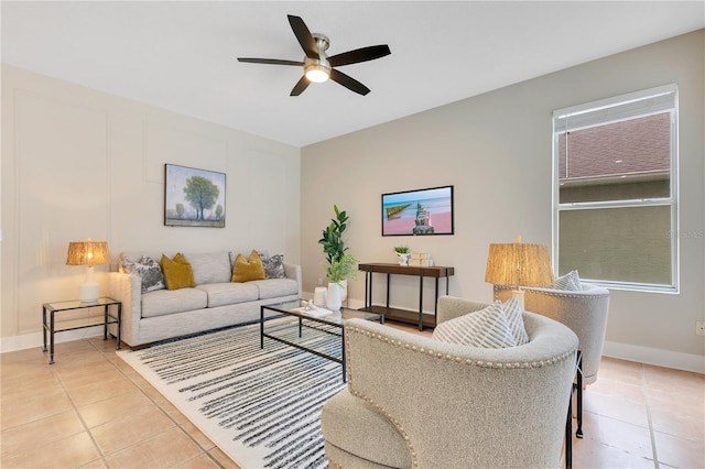 4993 Hook Hollow Cir, Orlando, FL 32837 - living room featuring a ceiling fan, light tile patterned floors, and baseboards