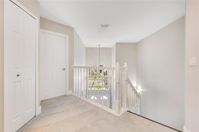 4993 Hook Hollow Cir, Orlando, FL 32837 - hall with an upstairs landing, carpet, and baseboards
