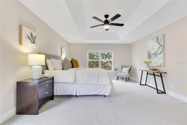 4993 Hook Hollow Cir, Orlando, FL 32837 - bedroom featuring carpet flooring, a tray ceiling, a ceiling fan, and baseboards