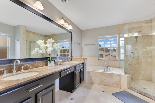4993 Hook Hollow Cir, Orlando, FL 32837 - full bathroom featuring a bath, double vanity, a stall shower, and tile patterned floors