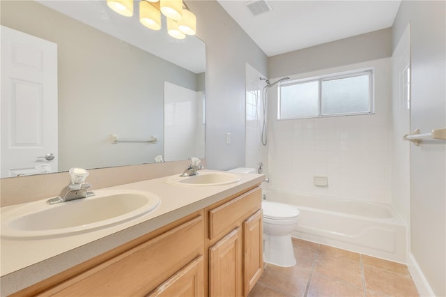 4993 Hook Hollow Cir, Orlando, FL 32837 - full bathroom featuring double vanity, shower / bathtub combination, toilet, and tile patterned flooring