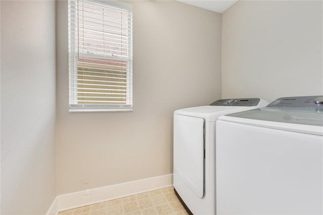 4993 Hook Hollow Cir, Orlando, FL 32837 - washroom with washing machine and dryer and baseboards
