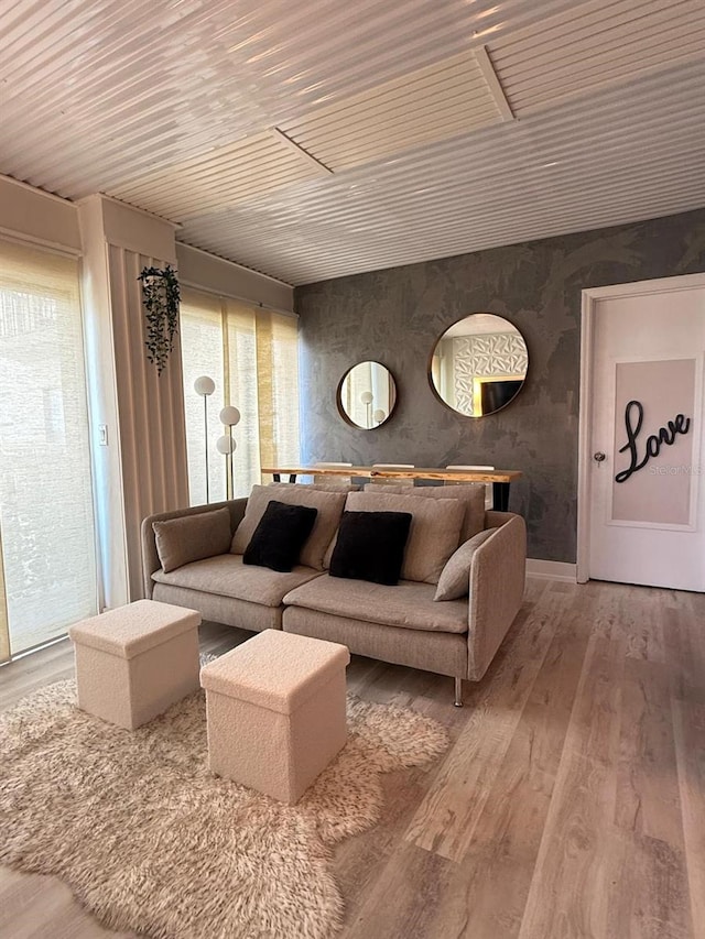 6165 Carrier Dr Unit 1801, Orlando, FL 32819 - living room featuring wood finished floors and wallpapered walls