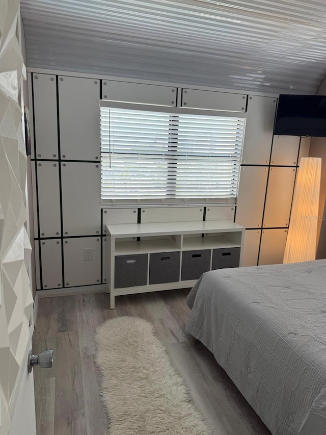 6165 Carrier Dr Unit 1801, Orlando, FL 32819 - bedroom featuring wood finished floors