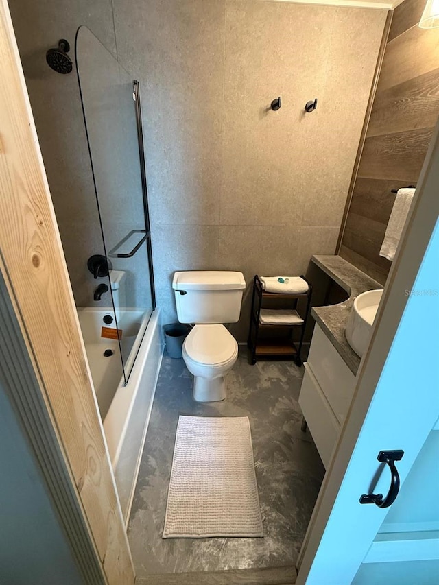 6165 Carrier Dr Unit 1801, Orlando, FL 32819 - bathroom with vanity, bathing tub / shower combination, toilet, and tile walls
