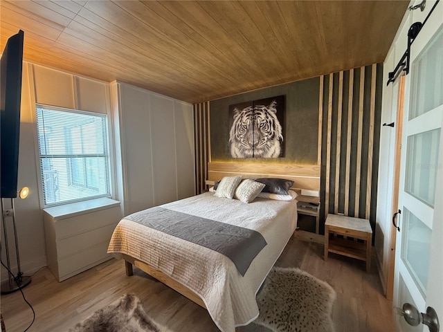 6165 Carrier Dr Unit 1801, Orlando, FL 32819 - bedroom with wood ceiling and wood finished floors