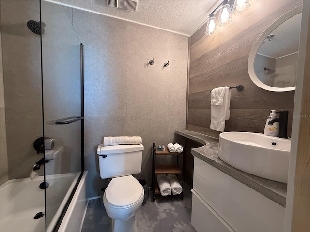 6165 Carrier Dr Unit 1801, Orlando, FL 32819 - bathroom with vanity, shower / tub combination, toilet, and a textured ceiling