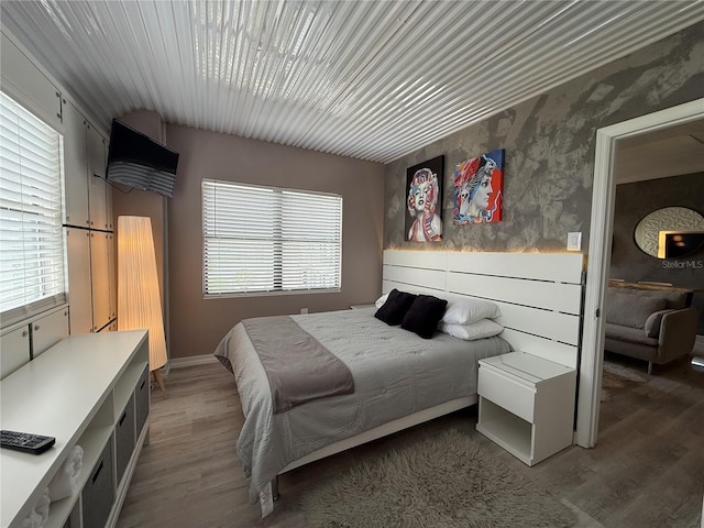 6165 Carrier Dr Unit 1801, Orlando, FL 32819 - bedroom with wood finished floors