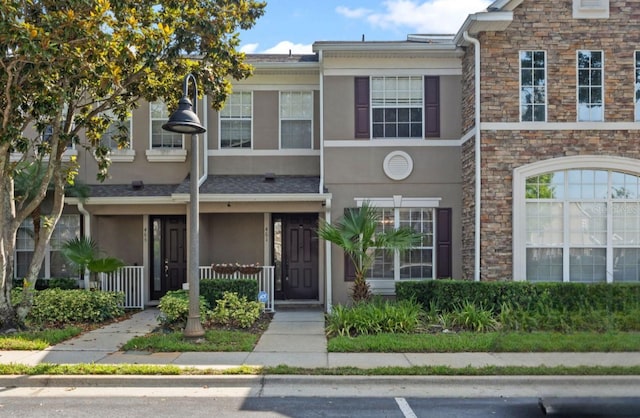 461 Black Knight Way, Longwood, FL 32779 - townhome / multi-family property featuring stucco siding and stone siding