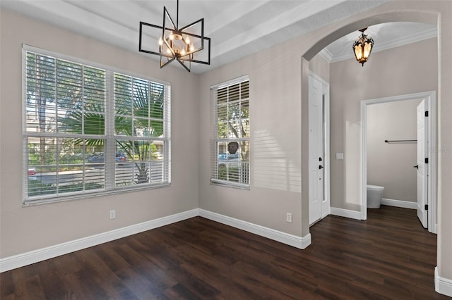 461 Black Knight Way, Longwood, FL 32779 - unfurnished dining area with a chandelier, arched walkways, dark wood-type flooring, and baseboards
