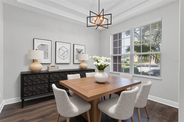 461 Black Knight Way, Longwood, FL 32779 - dining area featuring a chandelier, baseboards, dark wood finished floors, and a tray ceiling