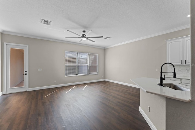 461 Black Knight Way, Longwood, FL 32779 - unfurnished living room featuring a sink, ornamental molding, ceiling fan, dark wood-style floors, and baseboards