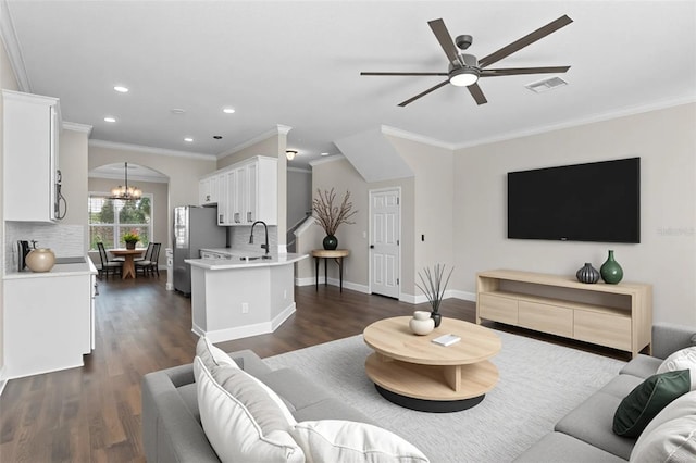461 Black Knight Way, Longwood, FL 32779 - living area featuring ceiling fan, recessed lighting, ornamental molding, dark wood-type flooring, and a chandelier
