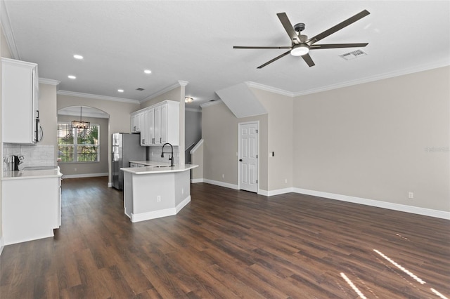 461 Black Knight Way, Longwood, FL 32779 - kitchen with crown molding, appliances with stainless steel finishes, ceiling fan, white cabinetry, and light countertops
