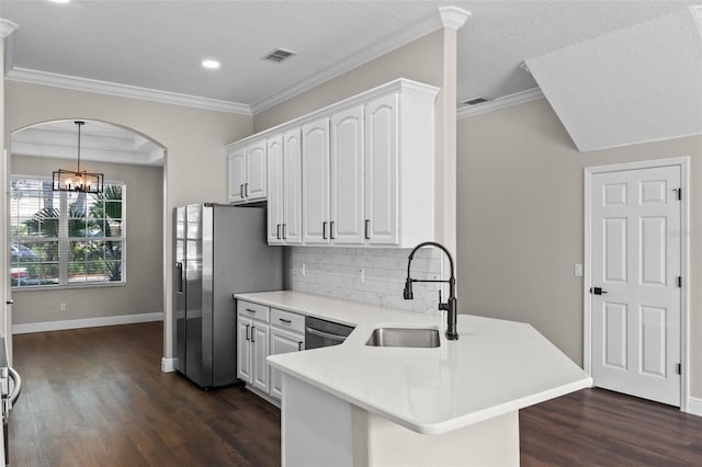 461 Black Knight Way, Longwood, FL 32779 - kitchen featuring a sink, a peninsula, white cabinets, dark wood finished floors, and decorative backsplash