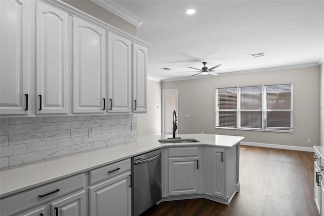 461 Black Knight Way, Longwood, FL 32779 - kitchen featuring dishwasher, a sink, a textured ceiling, ornamental molding, and a peninsula