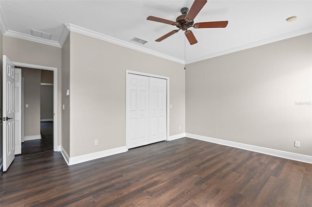 461 Black Knight Way, Longwood, FL 32779 - unfurnished bedroom featuring ornamental molding, dark wood-type flooring, baseboards, a closet, and ceiling fan