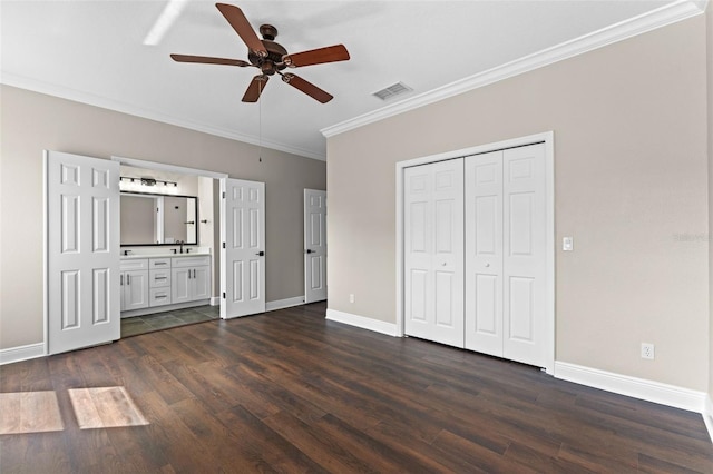461 Black Knight Way, Longwood, FL 32779 - unfurnished bedroom featuring crown molding, dark wood finished floors, baseboards, and a sink