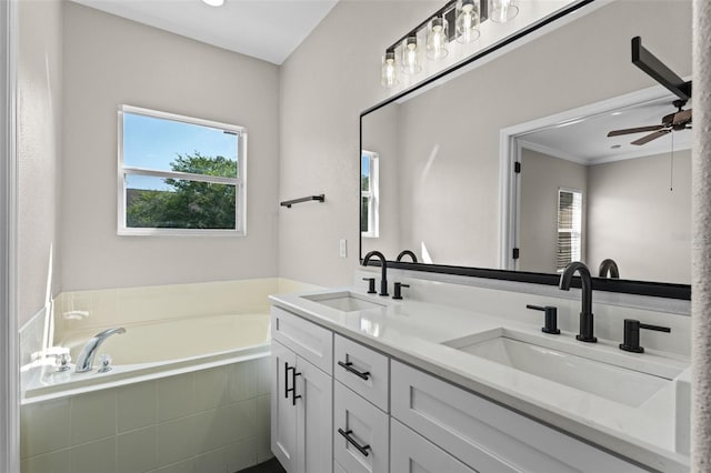 461 Black Knight Way, Longwood, FL 32779 - full bathroom featuring double vanity, a ceiling fan, a bath, plenty of natural light, and ornamental molding