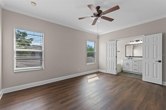 461 Black Knight Way, Longwood, FL 32779 - unfurnished bedroom featuring multiple windows, dark wood-style floors, ornamental molding, and baseboards