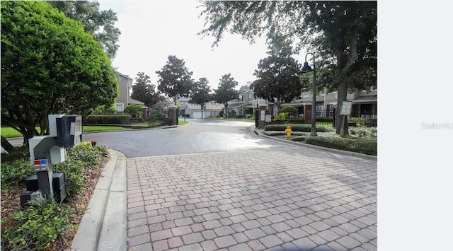 461 Black Knight Way, Longwood, FL 32779 - view of asphalt road featuring curbs, a residential view, a gated entry, and street lighting