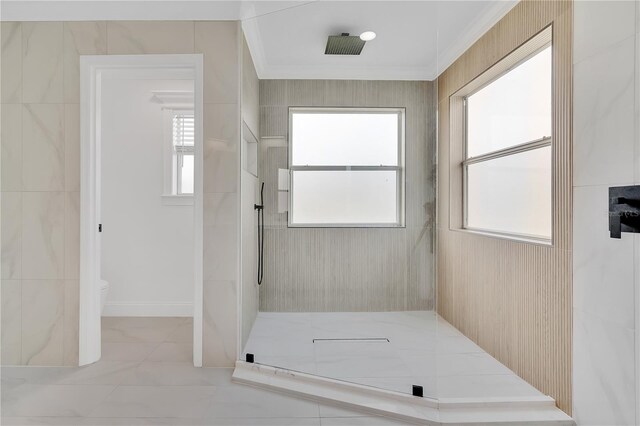 17657 Windy Pine St, Montverde, FL 34756 - full bathroom with tiled shower, crown molding, toilet, and plenty of natural light