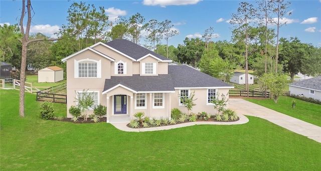 17657 Windy Pine St, Montverde, FL 34756 - view of front of house featuring a shingled roof, driveway, and stucco siding