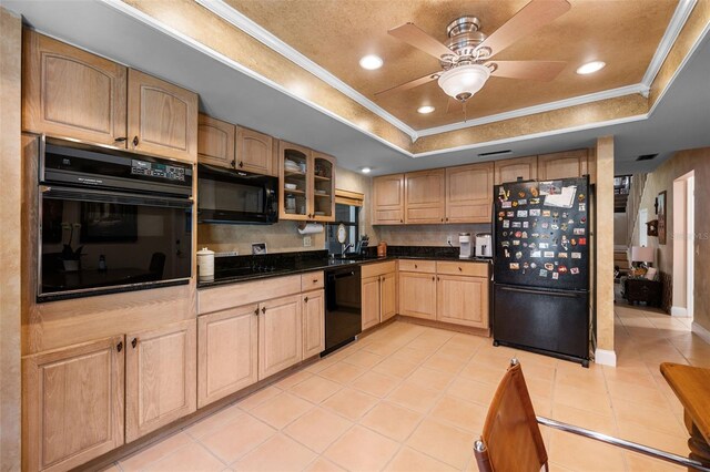 6460 Parson Brown Dr, Orlando, FL 32819 - kitchen featuring black appliances, a raised ceiling, a ceiling fan, crown molding, and light tile patterned floors