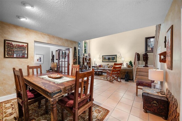 6460 Parson Brown Dr, Orlando, FL 32819 - dining area featuring a textured ceiling and light tile patterned flooring