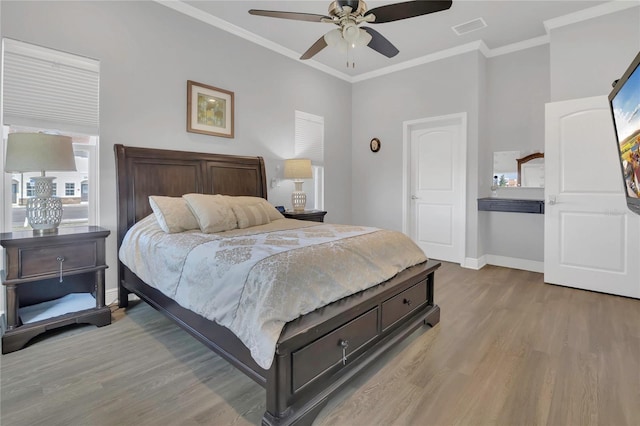 2100 Shantiniketan Blvd, Tavares, FL 32778 - bedroom with baseboards, wood finished floors, ornamental molding, and ceiling fan