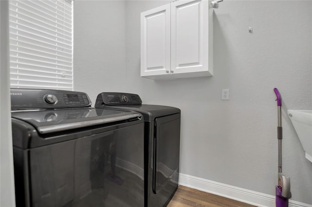 2100 Shantiniketan Blvd, Tavares, FL 32778 - washroom featuring washer and dryer, cabinet space, wood finished floors, and baseboards