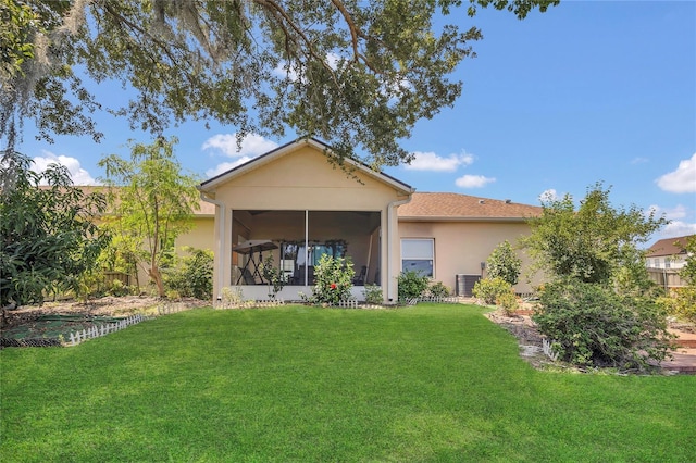 2100 Shantiniketan Blvd, Tavares, FL 32778 - back of house featuring stucco siding, a lawn, a sunroom, and cooling unit