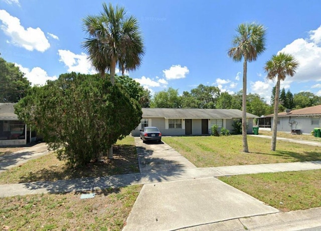 781-83 Lunar Lake Cir, Cocoa, FL 32926 - view of front of house with driveway and a front yard