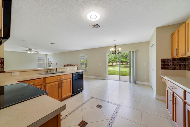 806 Sterling Spring Rd, Orlando, FL 32828 - kitchen featuring black appliances, a sink, a chandelier, light countertops, and a textured ceiling