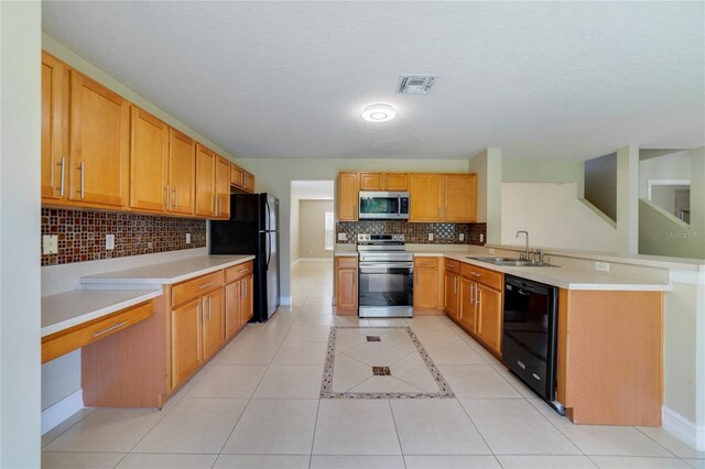 806 Sterling Spring Rd, Orlando, FL 32828 - kitchen with black appliances, a sink, tasteful backsplash, and light countertops